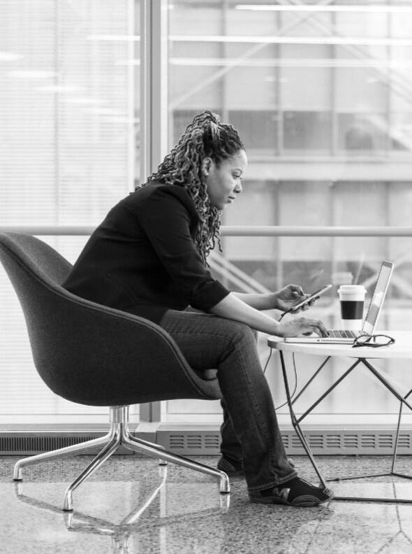 Woman looking at recruitment website on laptop