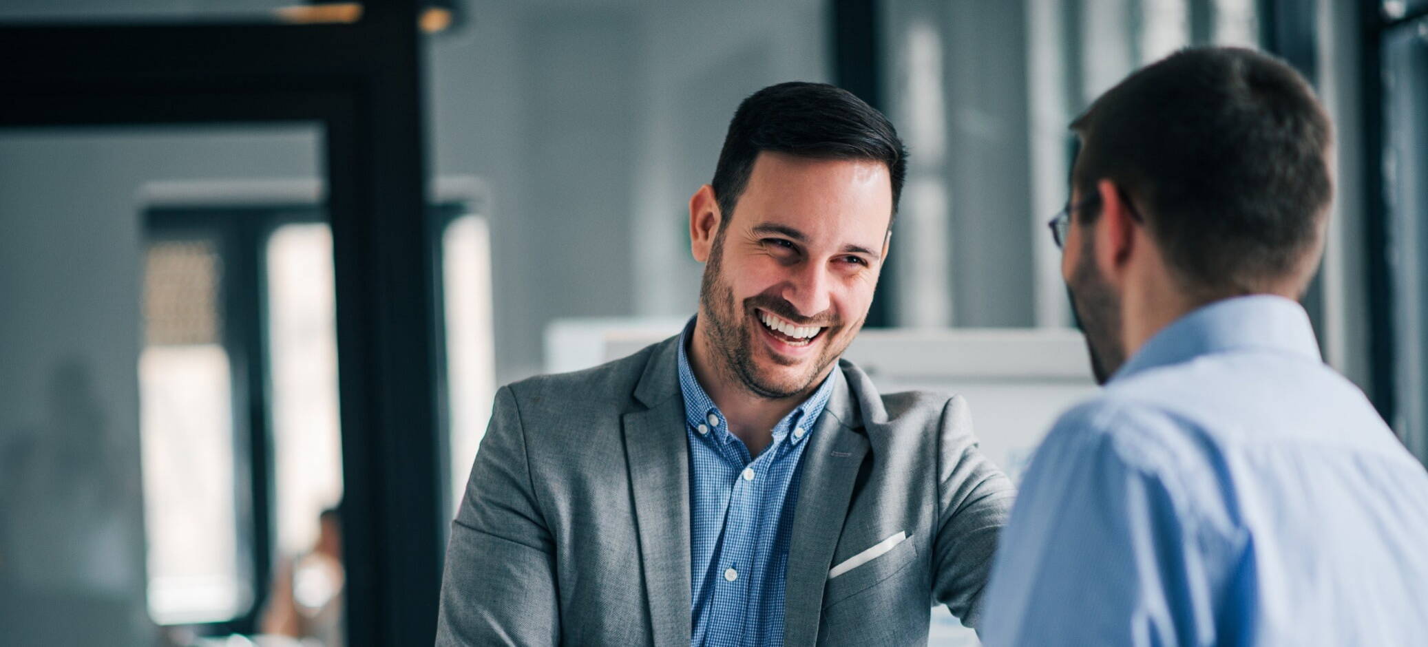 two recruiters laughing with each other