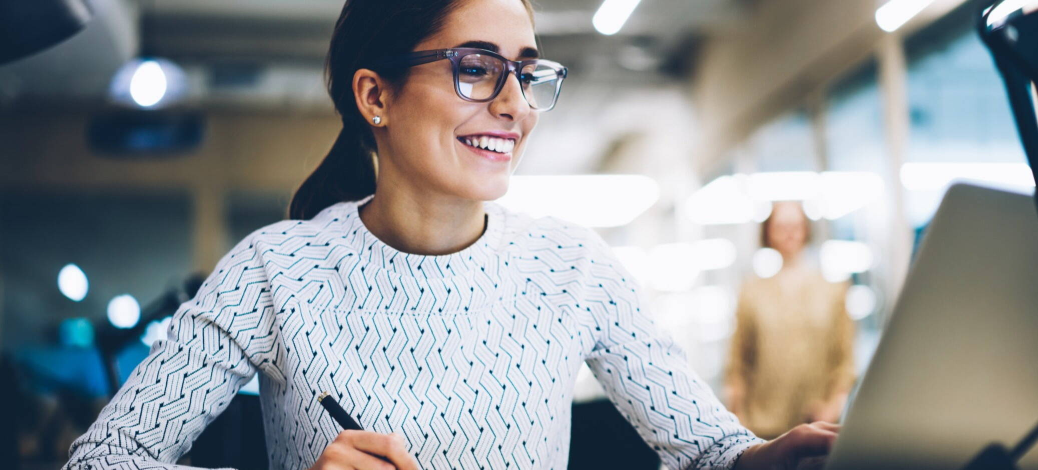 Happy recruitment marketer looking at their website by Access Volcanic