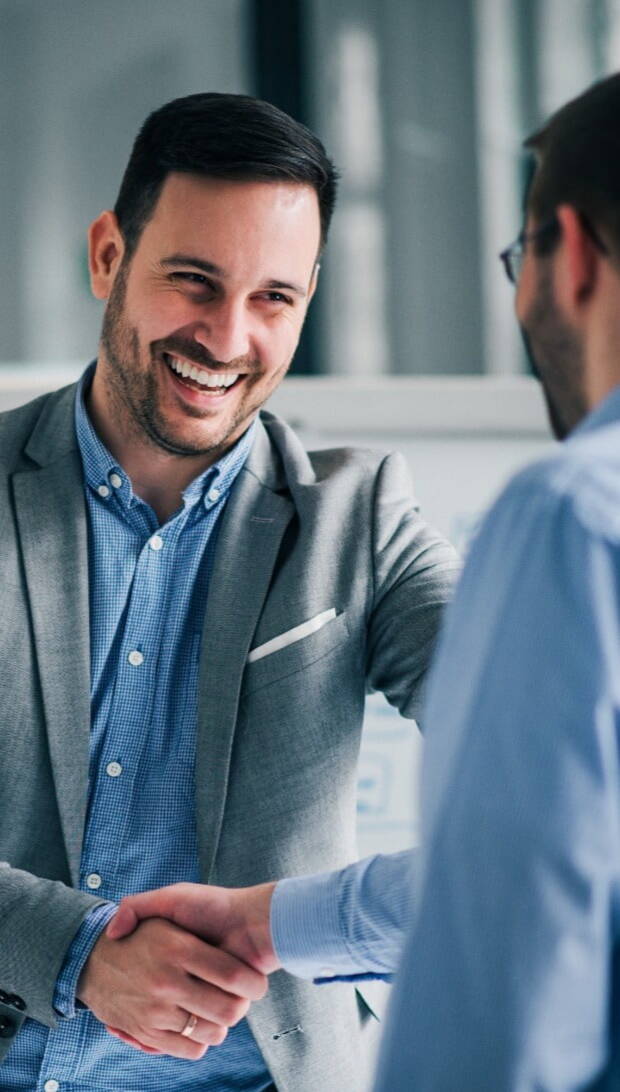 Man shaking hands with new client