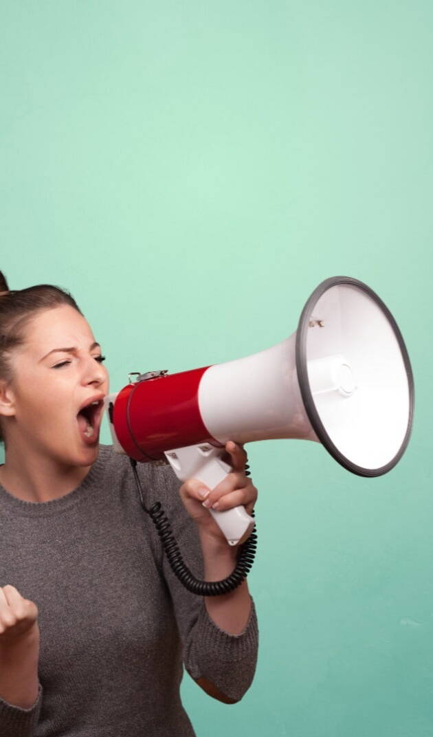 Woman shouting through megaphone