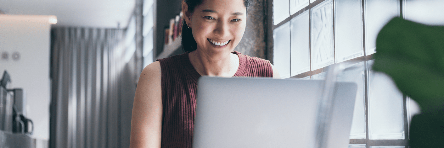 Smiling recruitment marketer watching demo of Access Volcanic